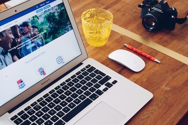 Laptop with a Facebook ad, highlighting on of the marketing mistakes you can make.